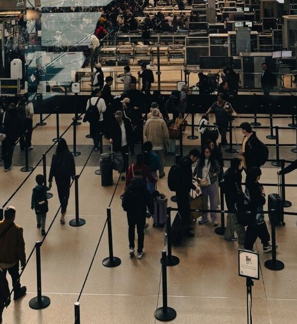 Long standard security line at an airport, the wait travelers avoid with TSA PreCheck or CLEAR