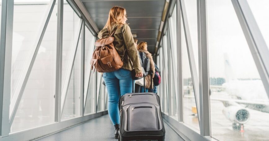 Traveler boarding a plane before an 11:55 a.m. flight